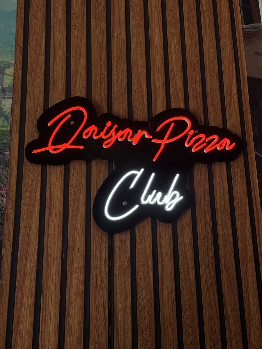 Neon sign for Qaisar Pizza Club